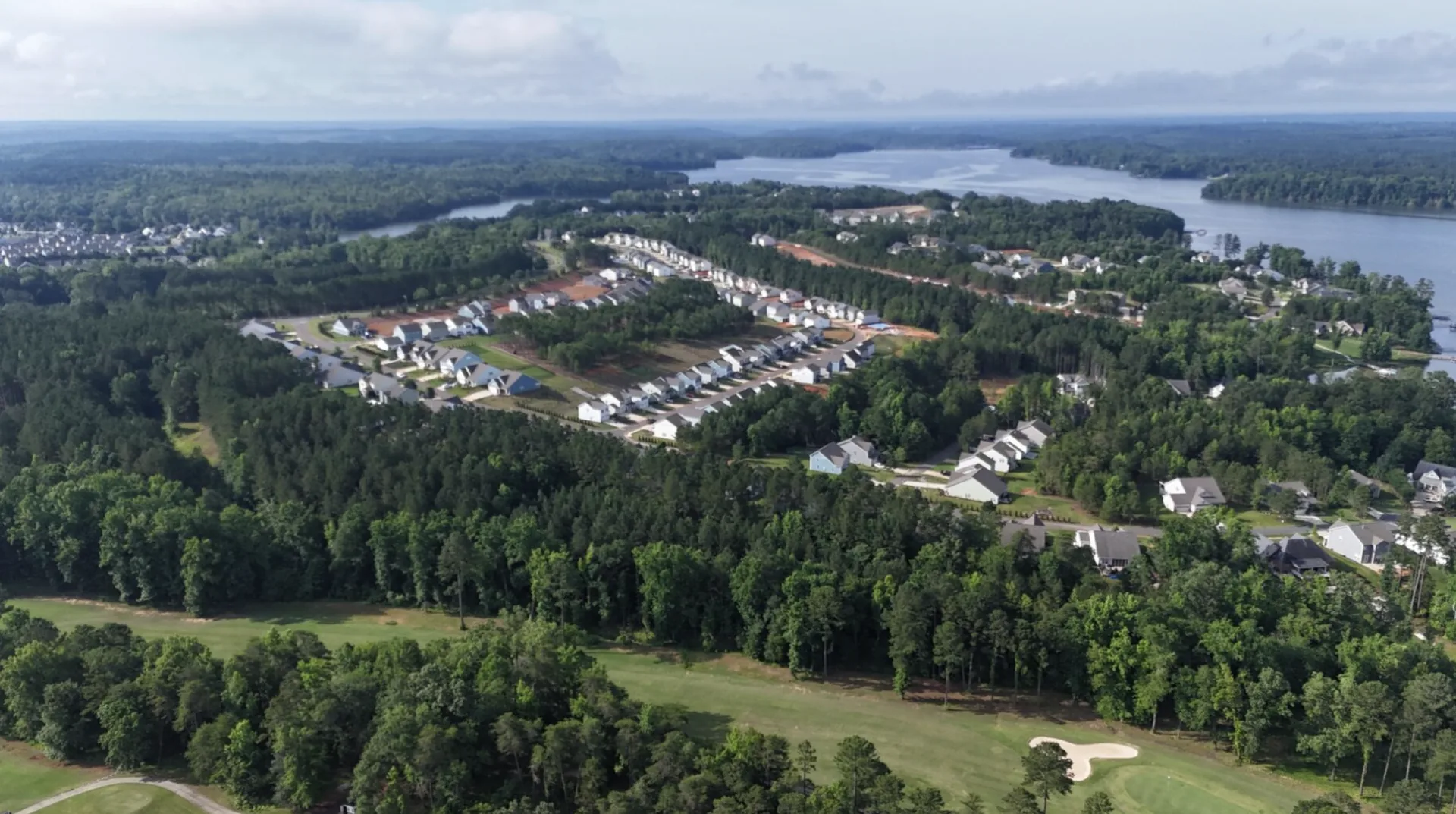 Aerial view of Lakeview Pointe — lake and golf course side by side