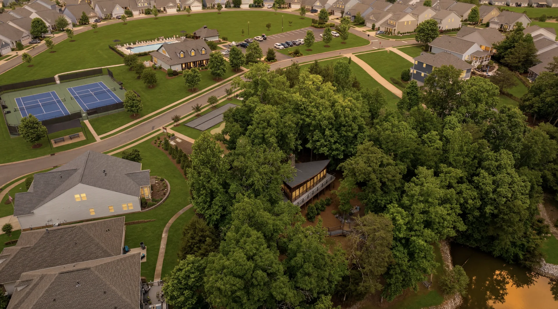 Pools, clubhouse, tennis courts, and lake pavilion at Edgewater
