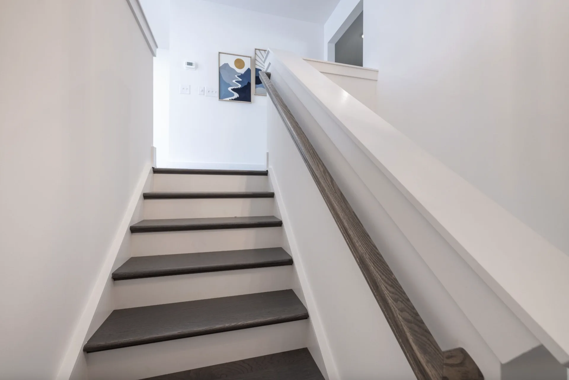 Hardwood floors leading to the loft in the Montcrest 1755