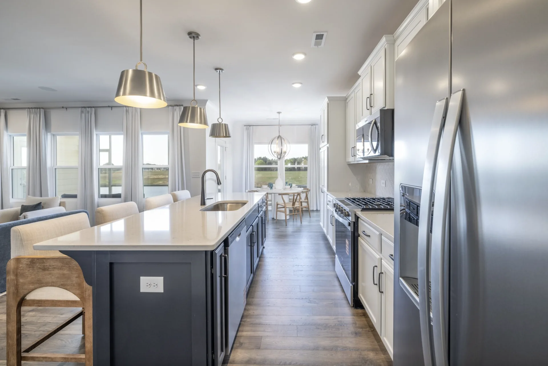 Gourmet kitchen with appliances and breakfast nook in the Montcrest 1755