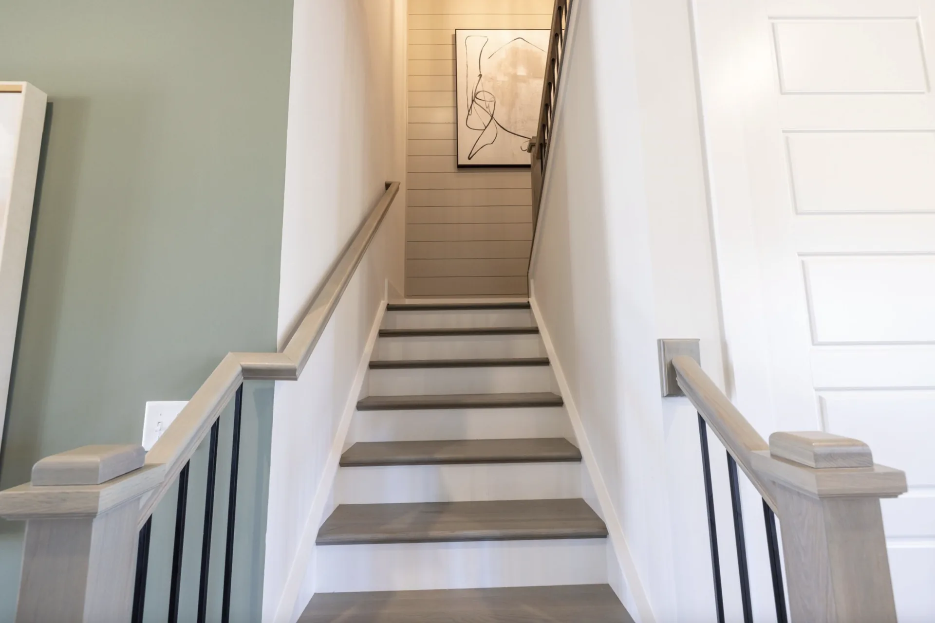 Lower hardwood staircase in the Winslow